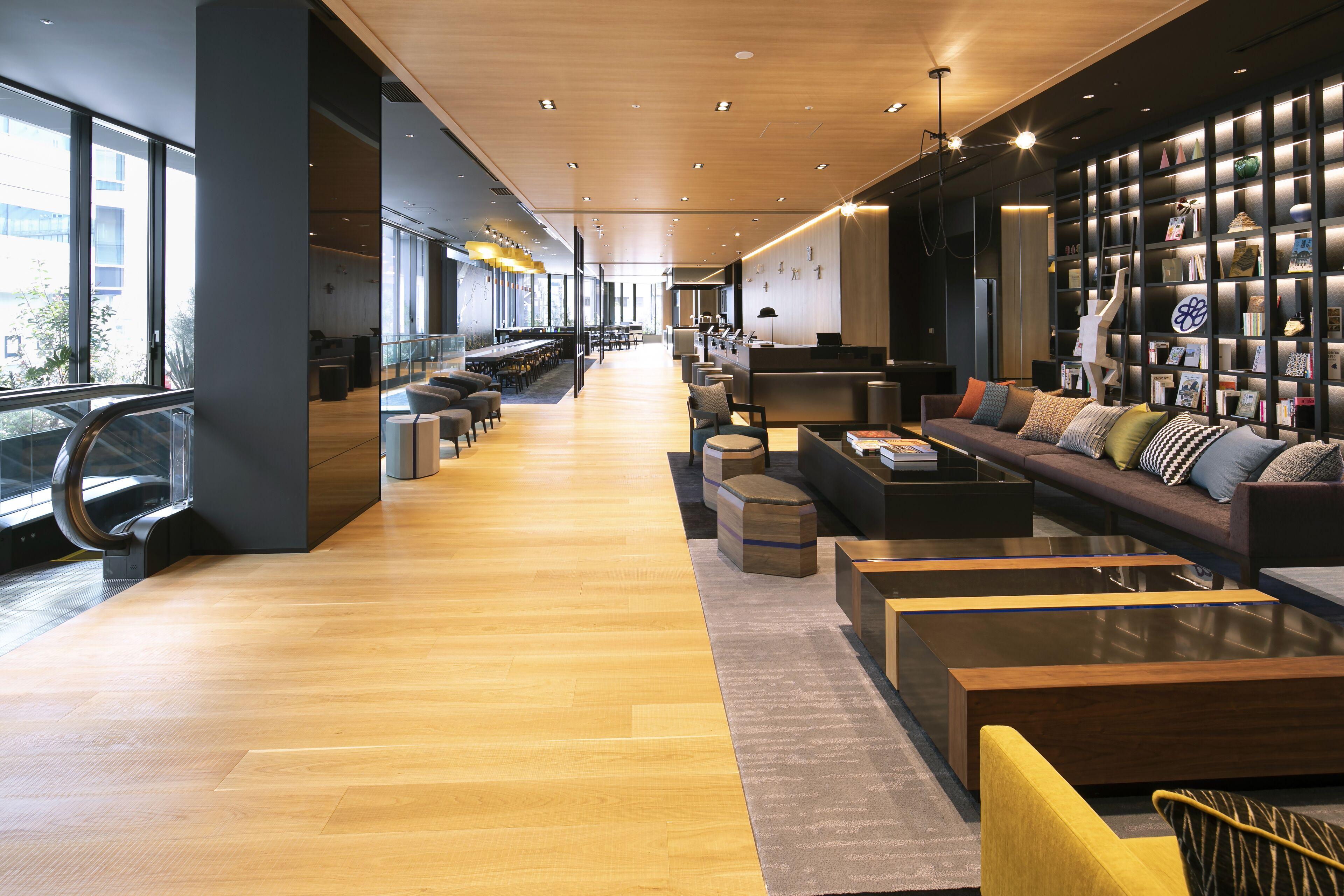 Luxury hotel lobby featuring MSPC flooring with elegant wood texture and superior durability for hospitality environments.jpg